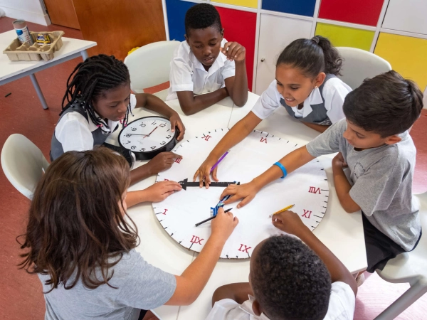 Primary Years Programme students working on an assignment inside a classroom.